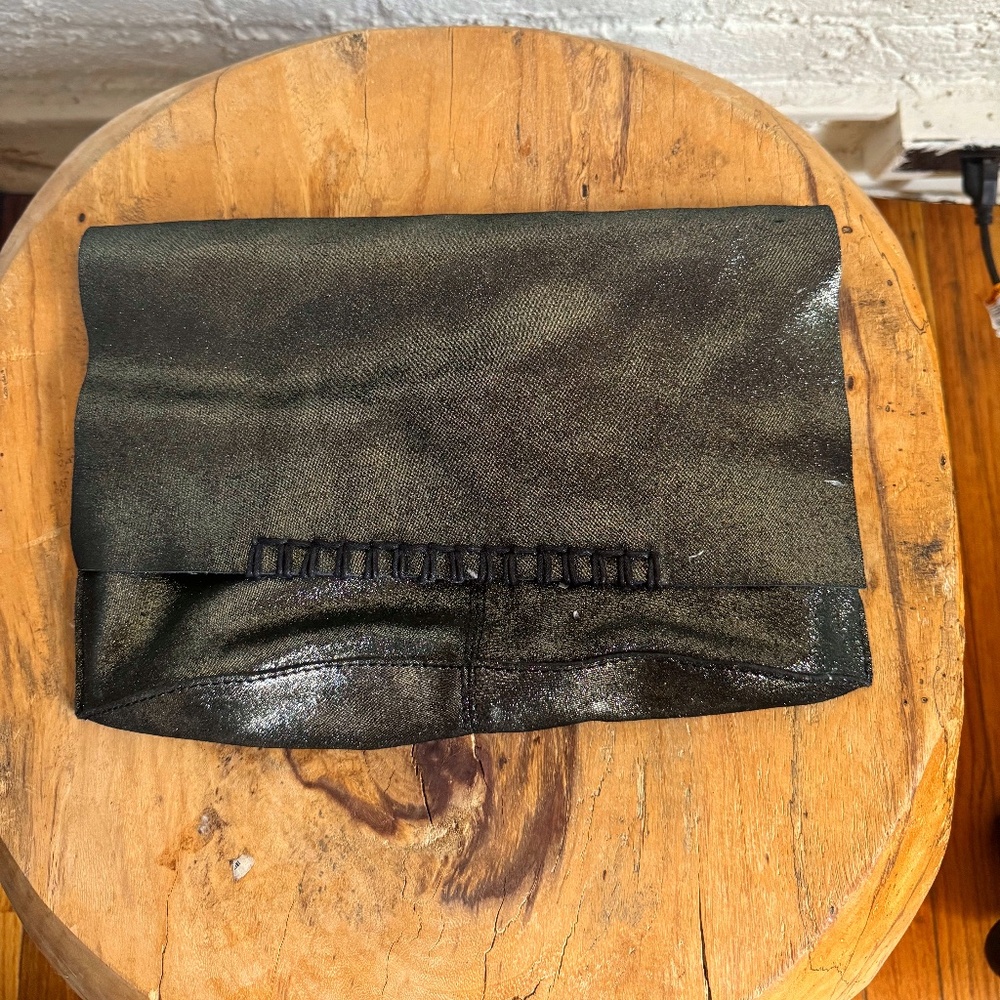 Metallic Leather Clutch With Black Cross Stitched Trim